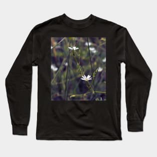 Tiny white flower on the grass background Long Sleeve T-Shirt